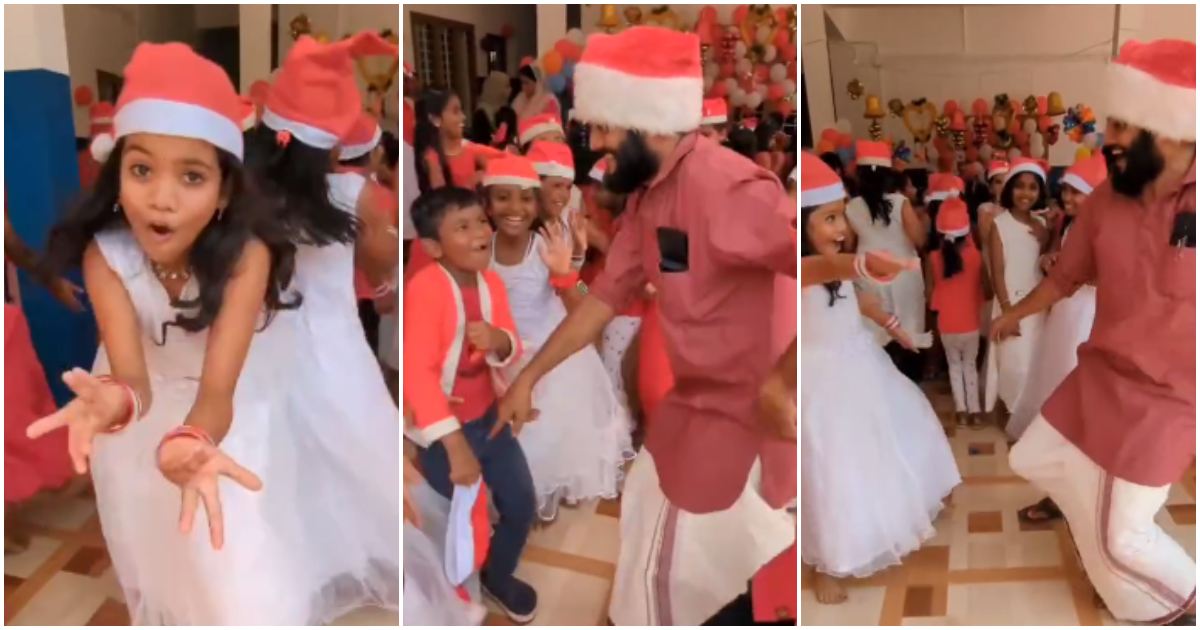 Students dancing with teacher school christmas celebration