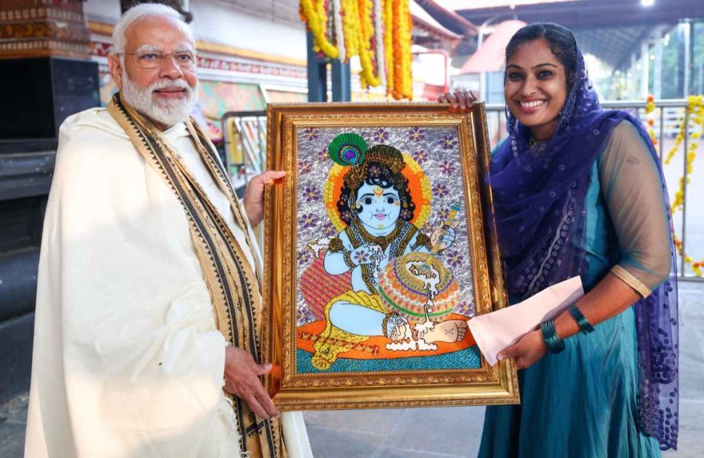 Jasna Salim presents Lord Krishna painting to PM Modi